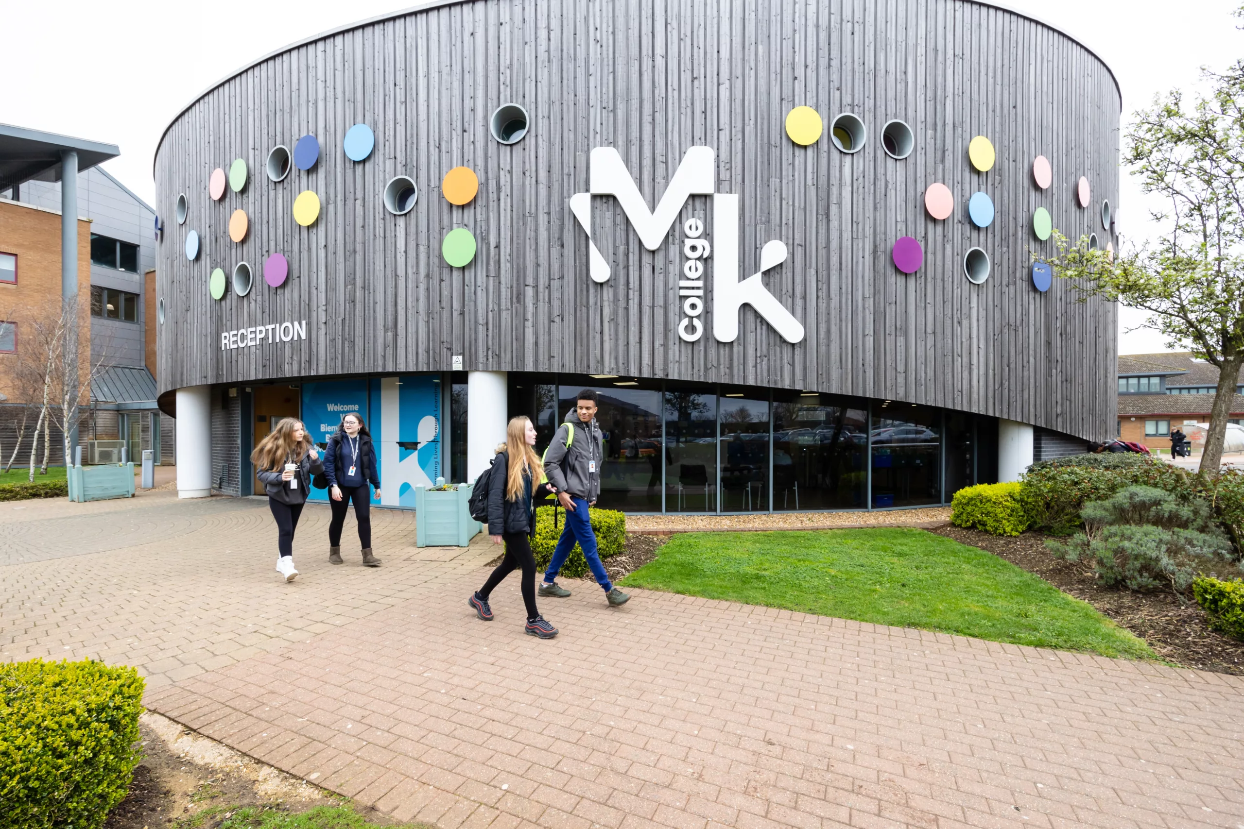 The front view of a modern college building with its entrance.